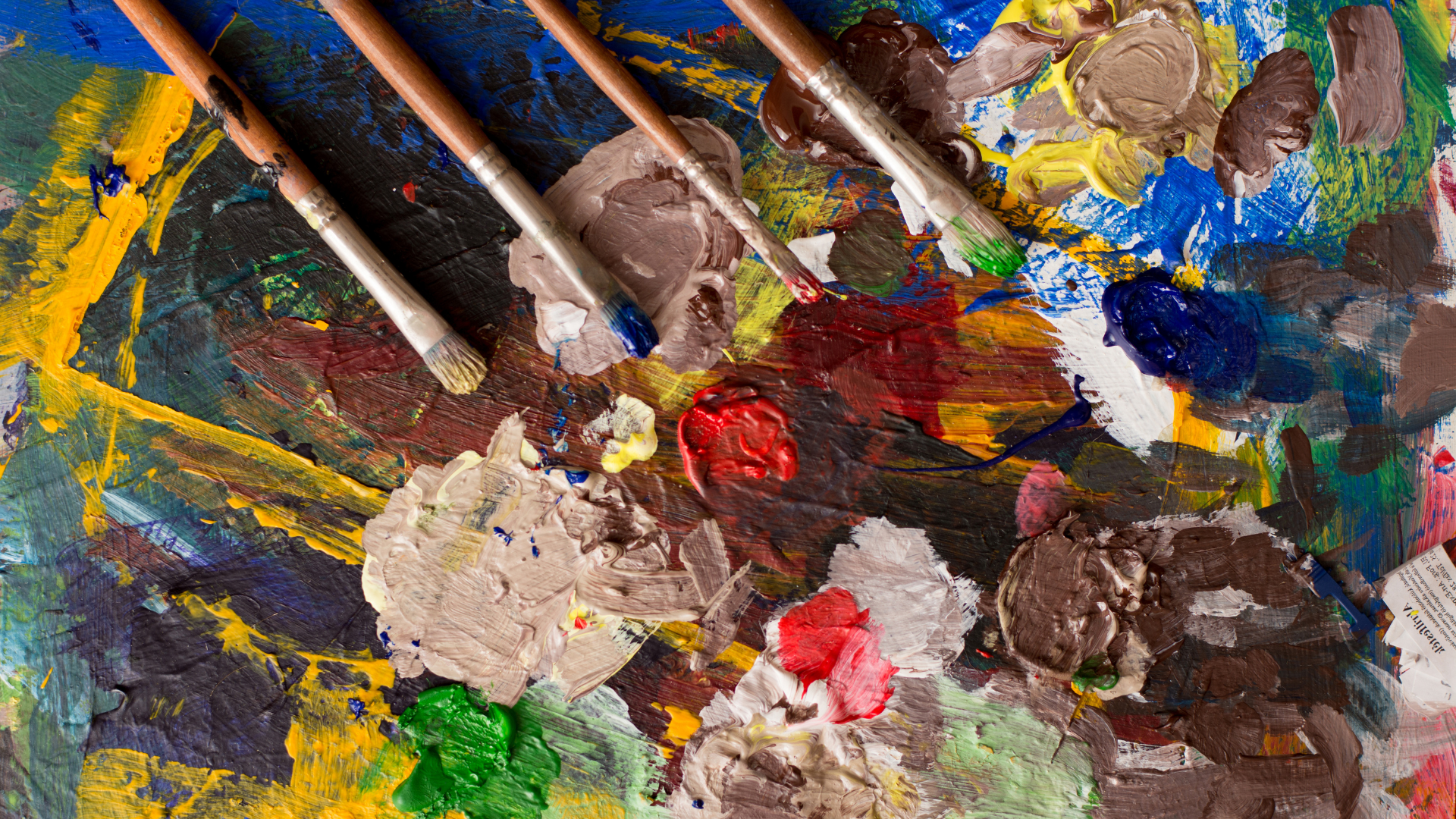 colorful paints and paint brushes
